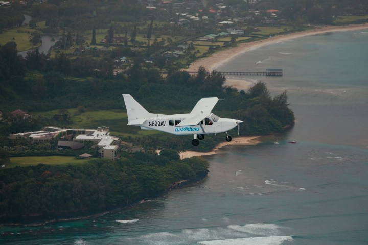 a plane flying over a body of water