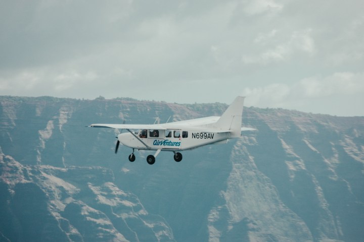 a large airplane flying high up in the air